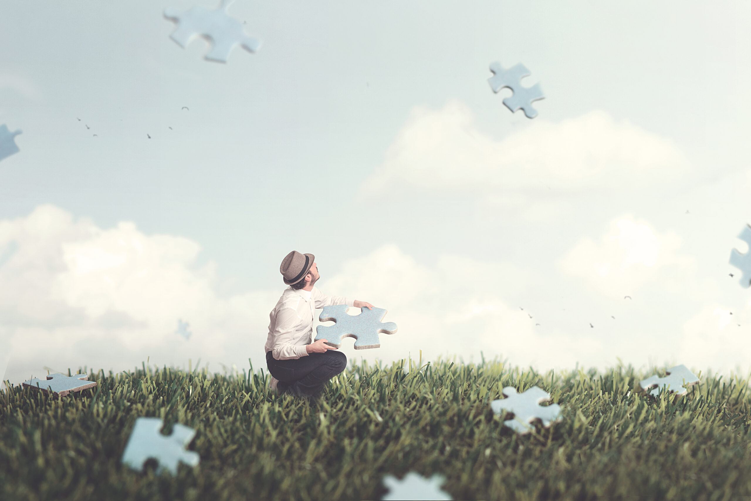 pieces puzzle falling from the sky surreal concept